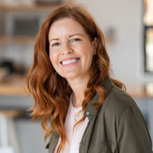 woman smiling after meeting with oral surgeon in Apple Valley, MN