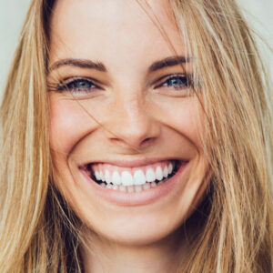 closeup of adult woman smiling after Oral Pathology in Apple Valley, Savage, Lakeville, MN, Eagan, Burnsville