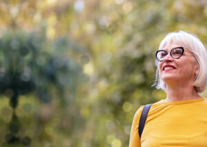 mature woman in glasses enjoying the outdoors after Oral Pathology in Apple Valley, Savage, MN, Owatonna, Eagan, Lakeville, MN, Burnsville